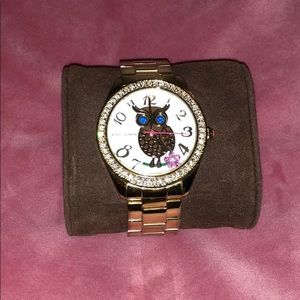 Gold Betsey Johnson watch with an owl on the face